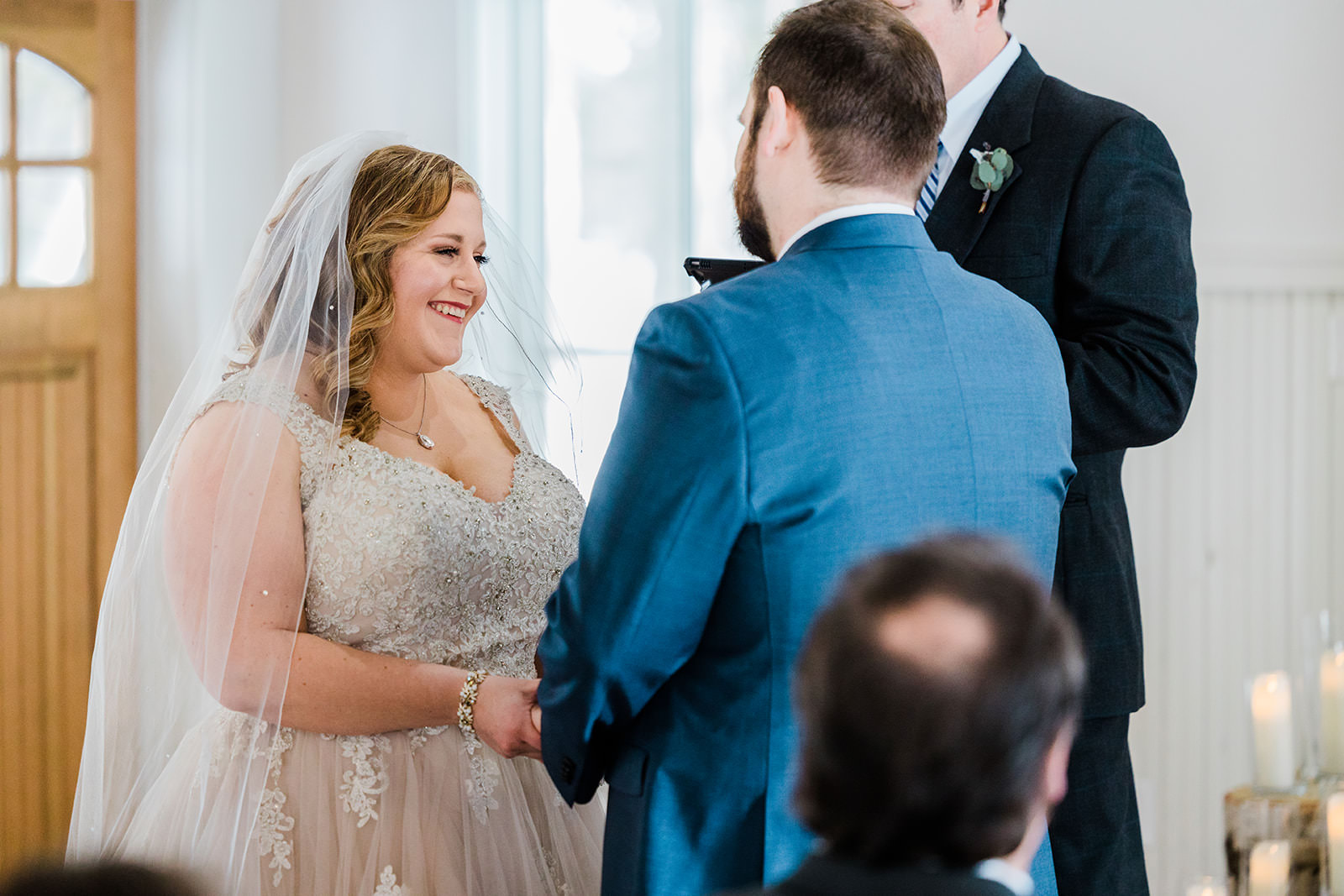 Lauren smiling during the ceremony — chapel with natural light at Grand View Lodge — Tim Larsen Photography, Brainerd Lakes MN