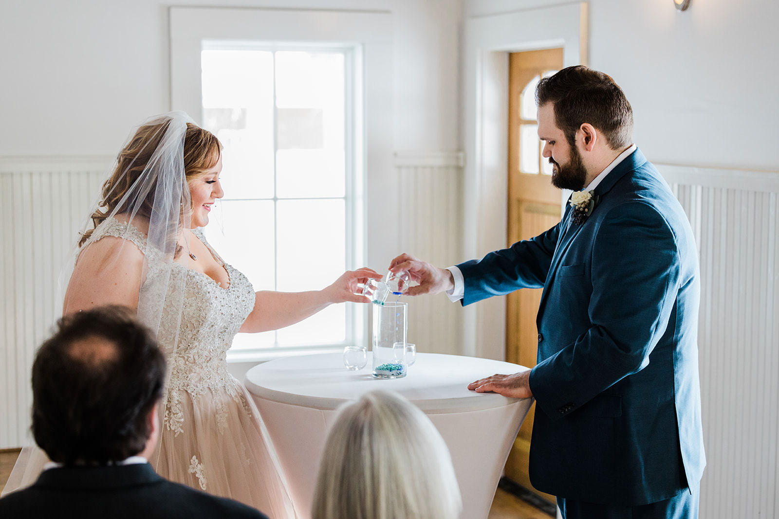 Sand ceremony — Lauren and Matthew at the altar in The Chapel — Tim Larsen Photography, Brainerd Lakes MN