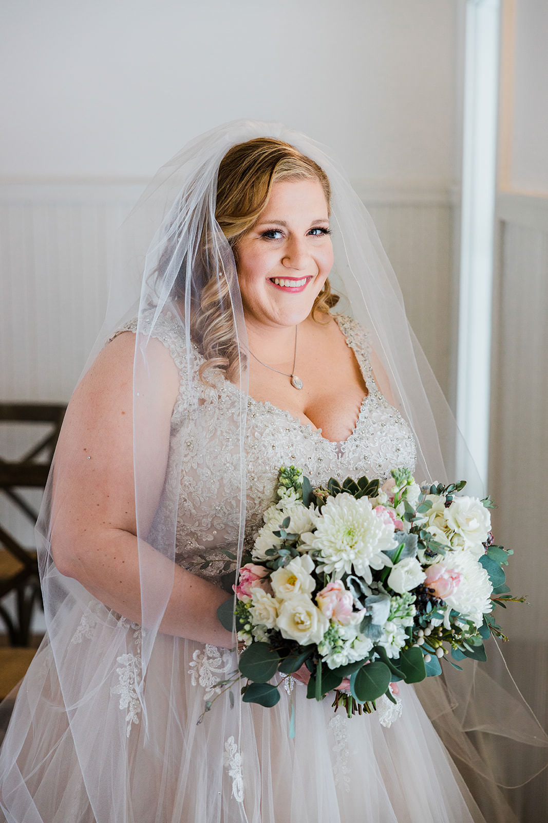 Lauren smiling with bouquet — bridal portrait at Grand View Lodge chapel — Tim Larsen Photography, Brainerd Lakes MN