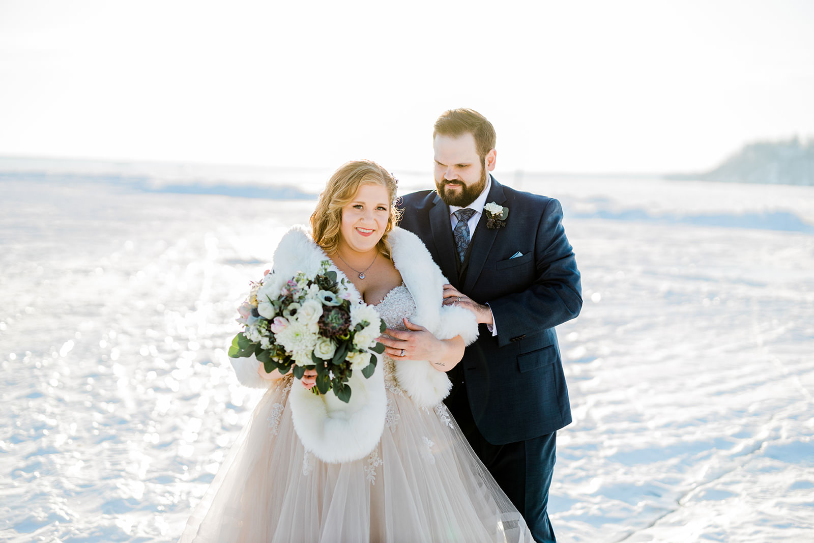 Lauren and Matthew on the frozen lake — fur stole and winter light on Gull Lake — Tim Larsen Photography, Brainerd Lakes MN