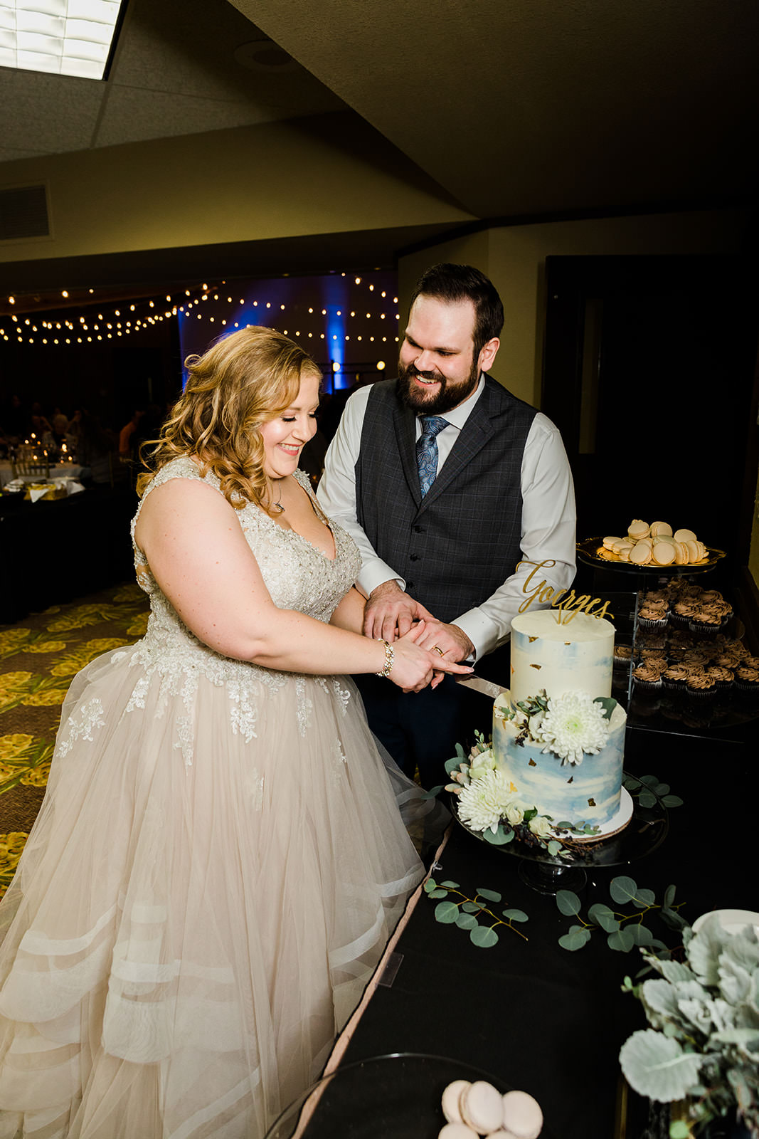 Lauren and Matthew cutting the cake — Grand View Lodge reception — Tim Larsen Photography, Brainerd Lakes MN
