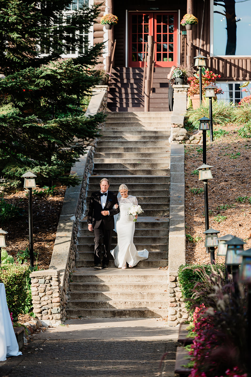 Grand Staircase ceremony with flowers and lanterns — Grand View Lodge on Gull Lake — Tim Larsen Photography, Brainerd Lakes MN