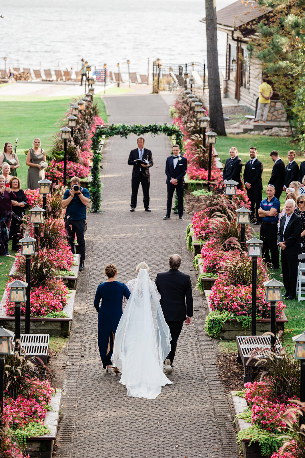 Walking down the Grand Staircase as husband and wife — Grand View Lodge ceremony on Gull Lake — Tim Larsen Photography, Brainerd Lakes MN