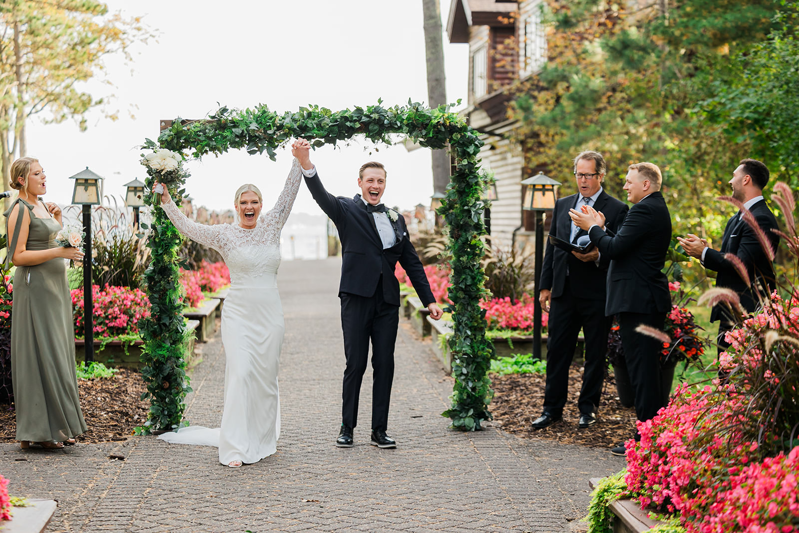 Celebration exit — arms raised on the Grand Staircase — Tim Larsen Photography, Brainerd Lakes MN