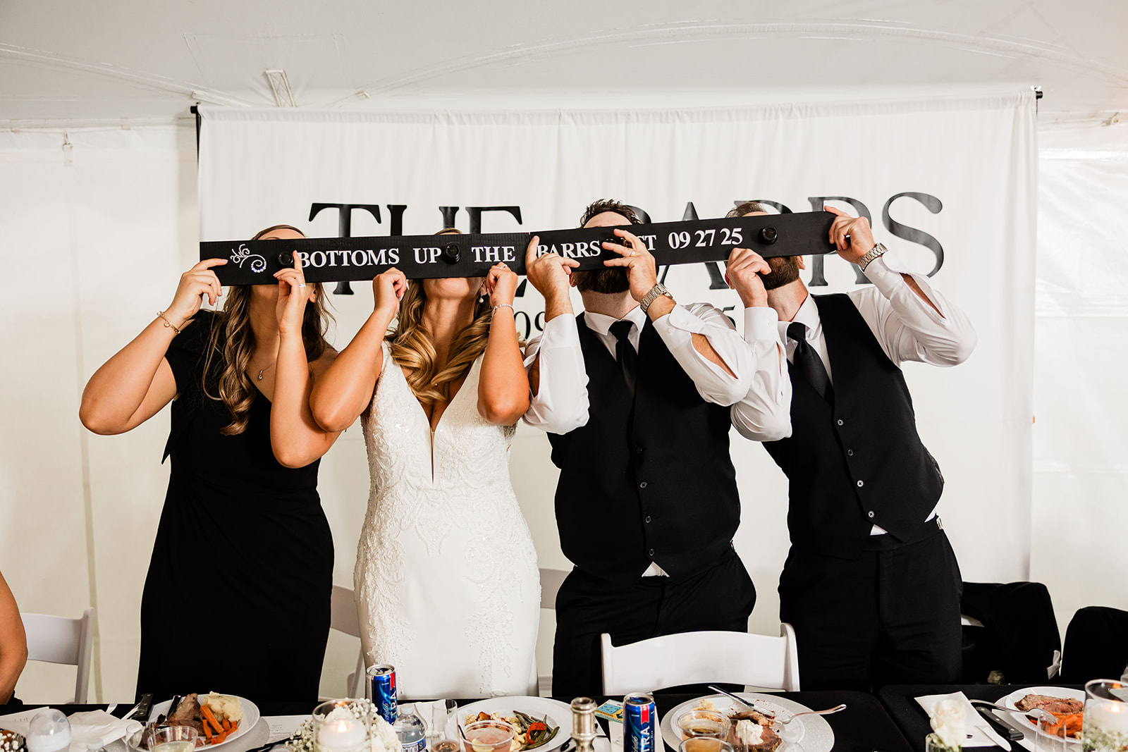 Wedding party with THE BARRS shot ski — tent reception at The Cove on Whitefish Lake