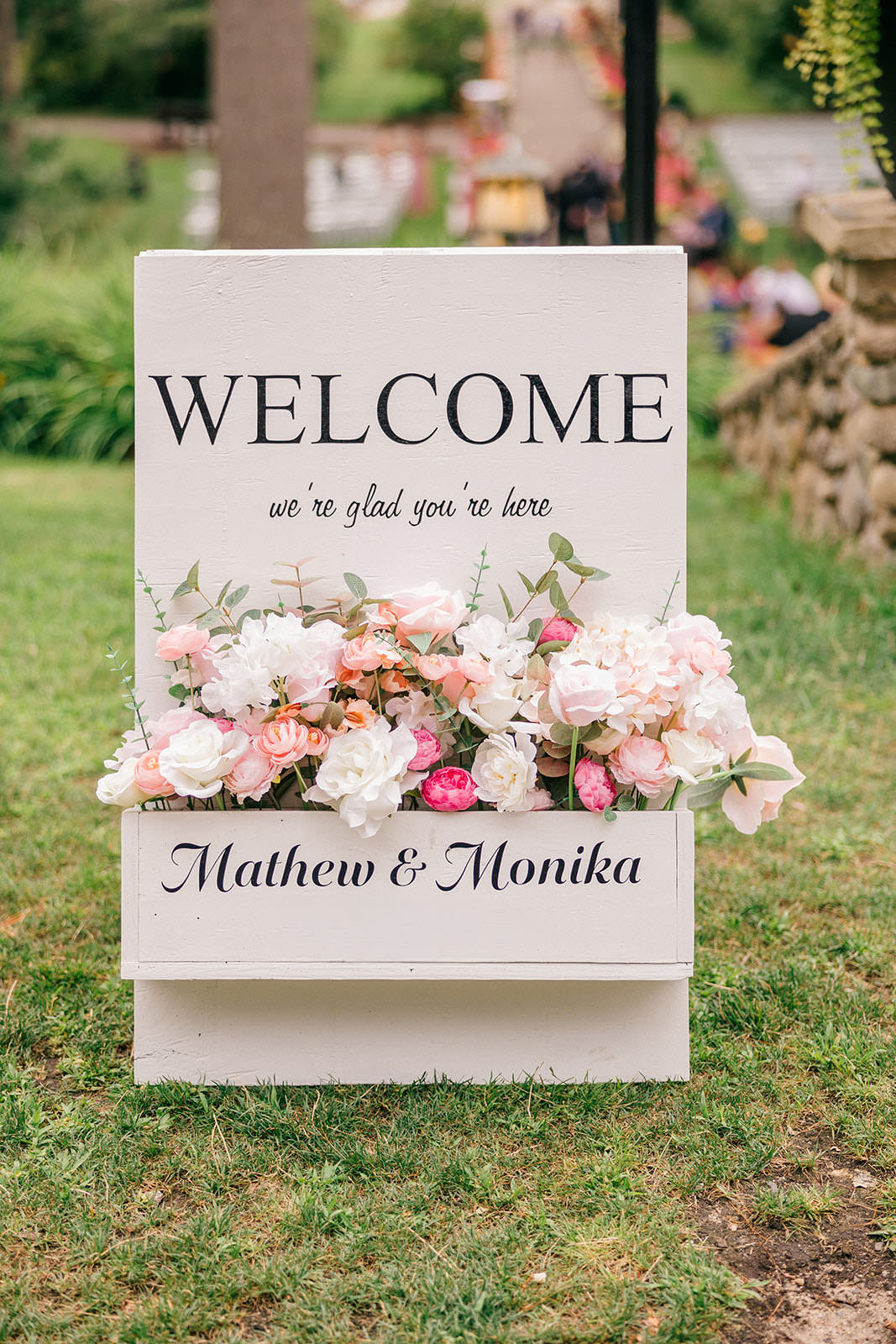 Welcome sign with flowers reading Mathew and Monika — Tim Larsen Photography, Brainerd Lakes MN