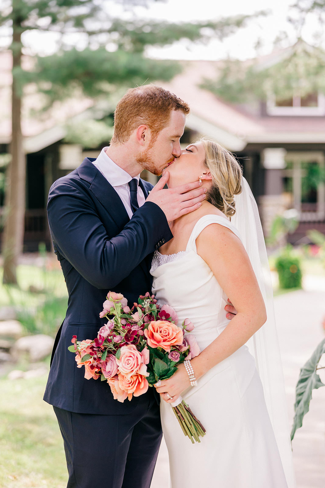 Couple kissing in the gardens at Grand View Lodge — Tim Larsen Photography, Brainerd Lakes MN