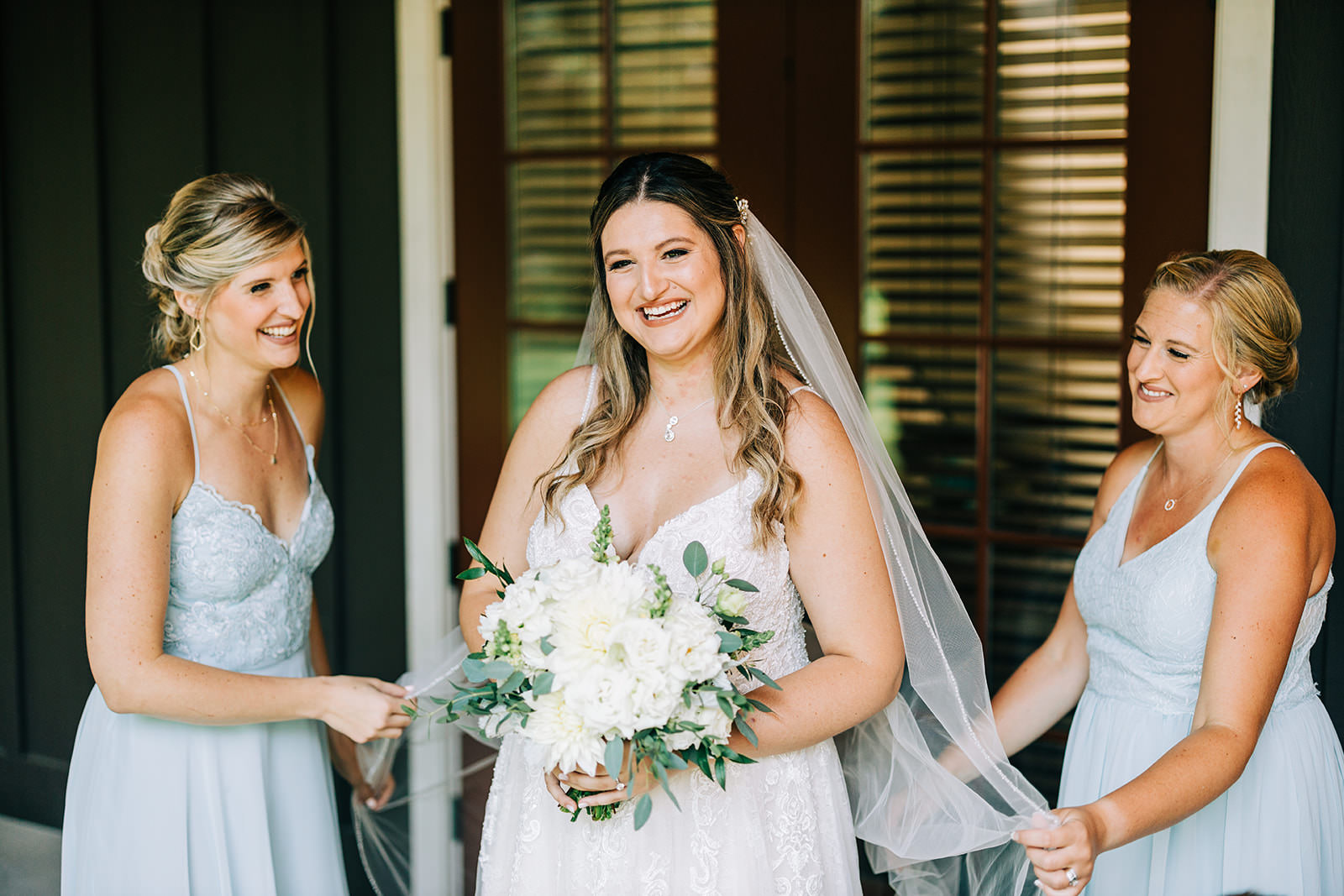 Shannon with her bridesmaids — light blue dresses and white bouquets at Grand View Lodge — Tim Larsen Photography, Brainerd Lakes MN