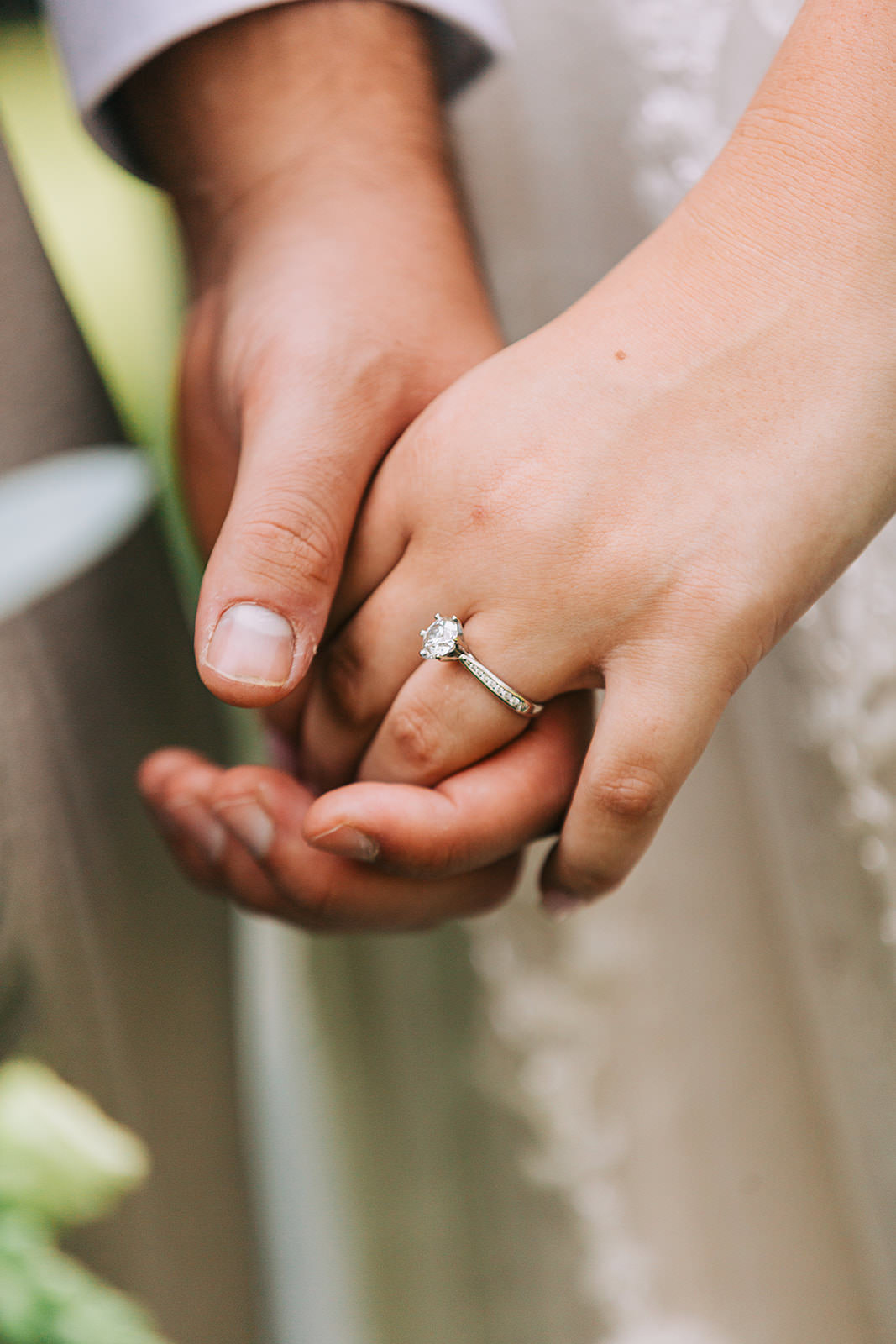 Ring detail — hands intertwined after the ceremony — Tim Larsen Photography, Brainerd Lakes MN