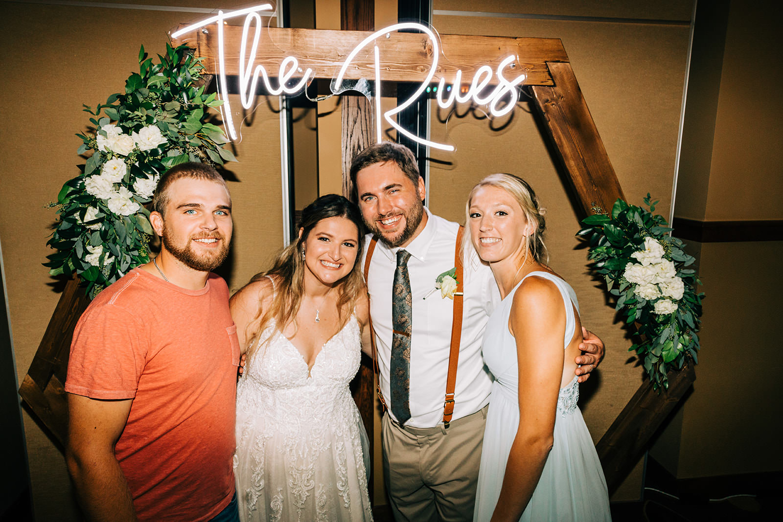 Shannon and Jon with friends at The Rues neon sign photo booth — Tim Larsen Photography, Brainerd Lakes MN