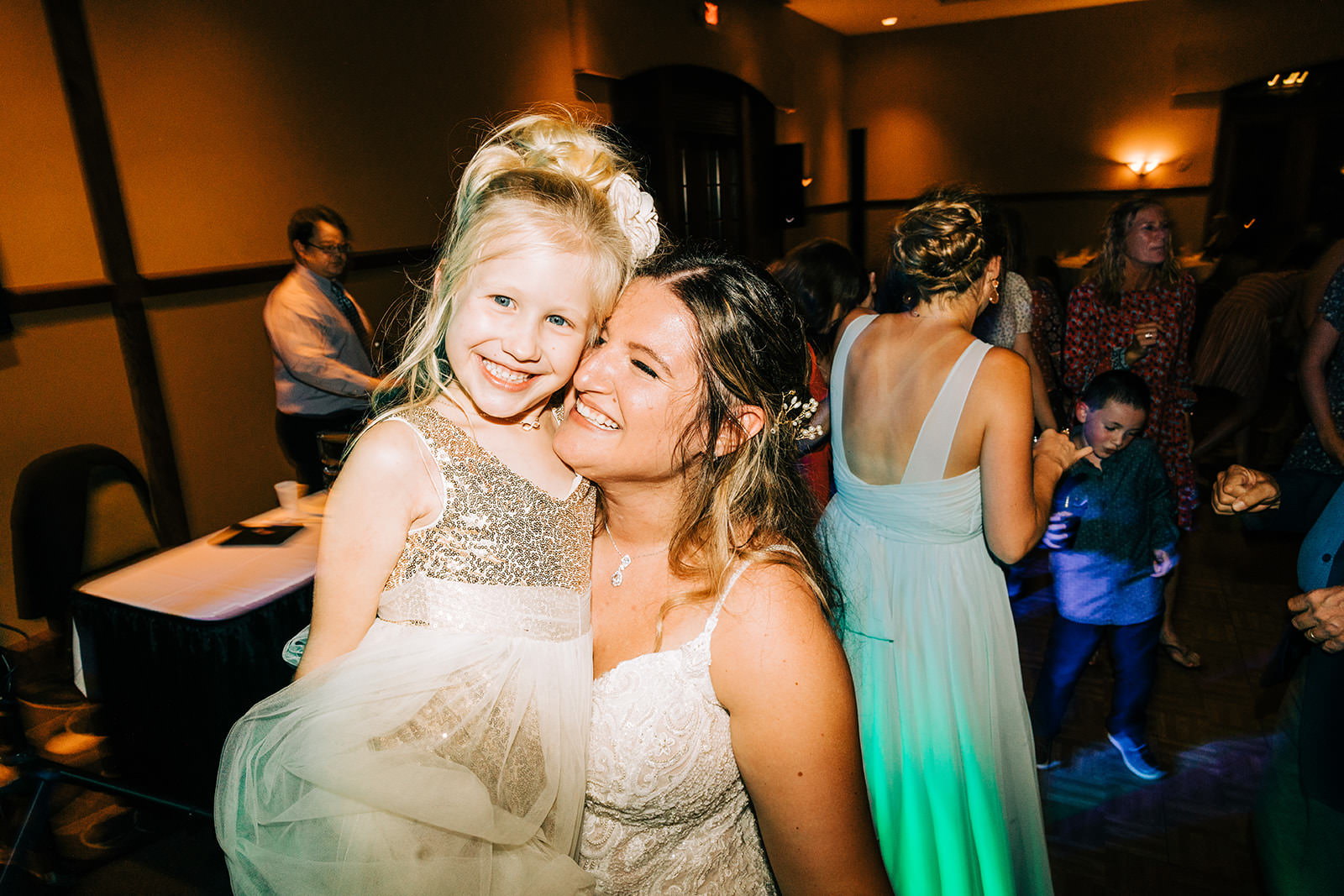 Shannon hugging the flower girl on the dance floor — Grand View Lodge reception — Tim Larsen Photography, Brainerd Lakes MN