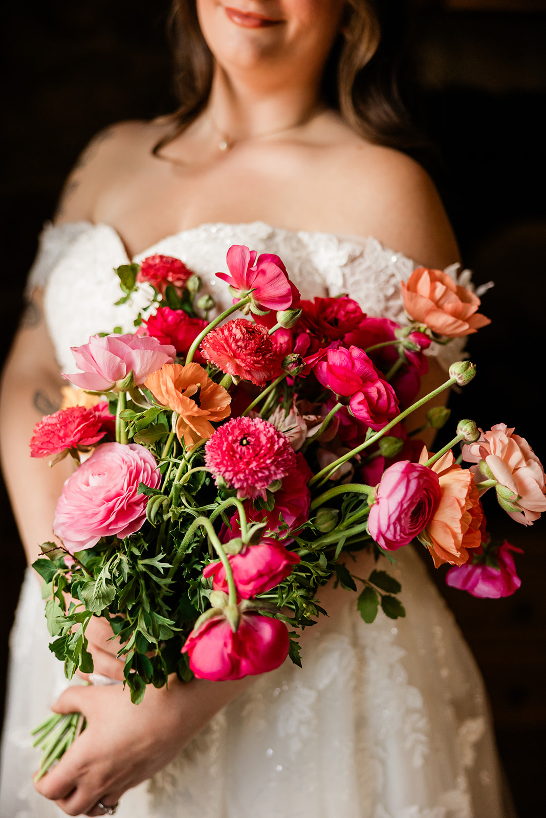 Bride holding a vibrant pink and coral bouquet — floral detail — Tim Larsen Photography, Brainerd Lakes MN