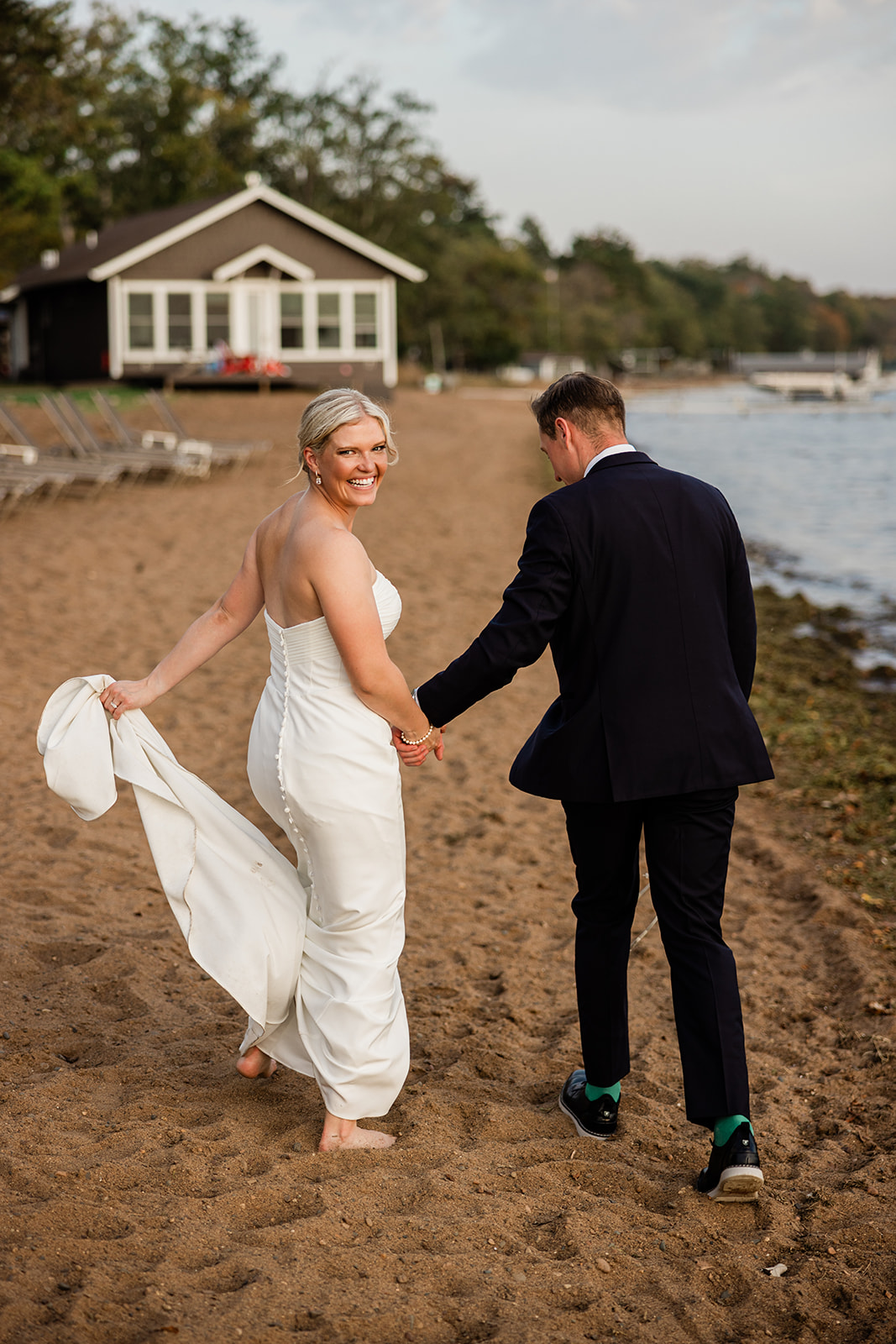 Bride walking barefoot on the beach at a Brainerd Lakes wedding — Tim Larsen Photography, Brainerd Lakes MN