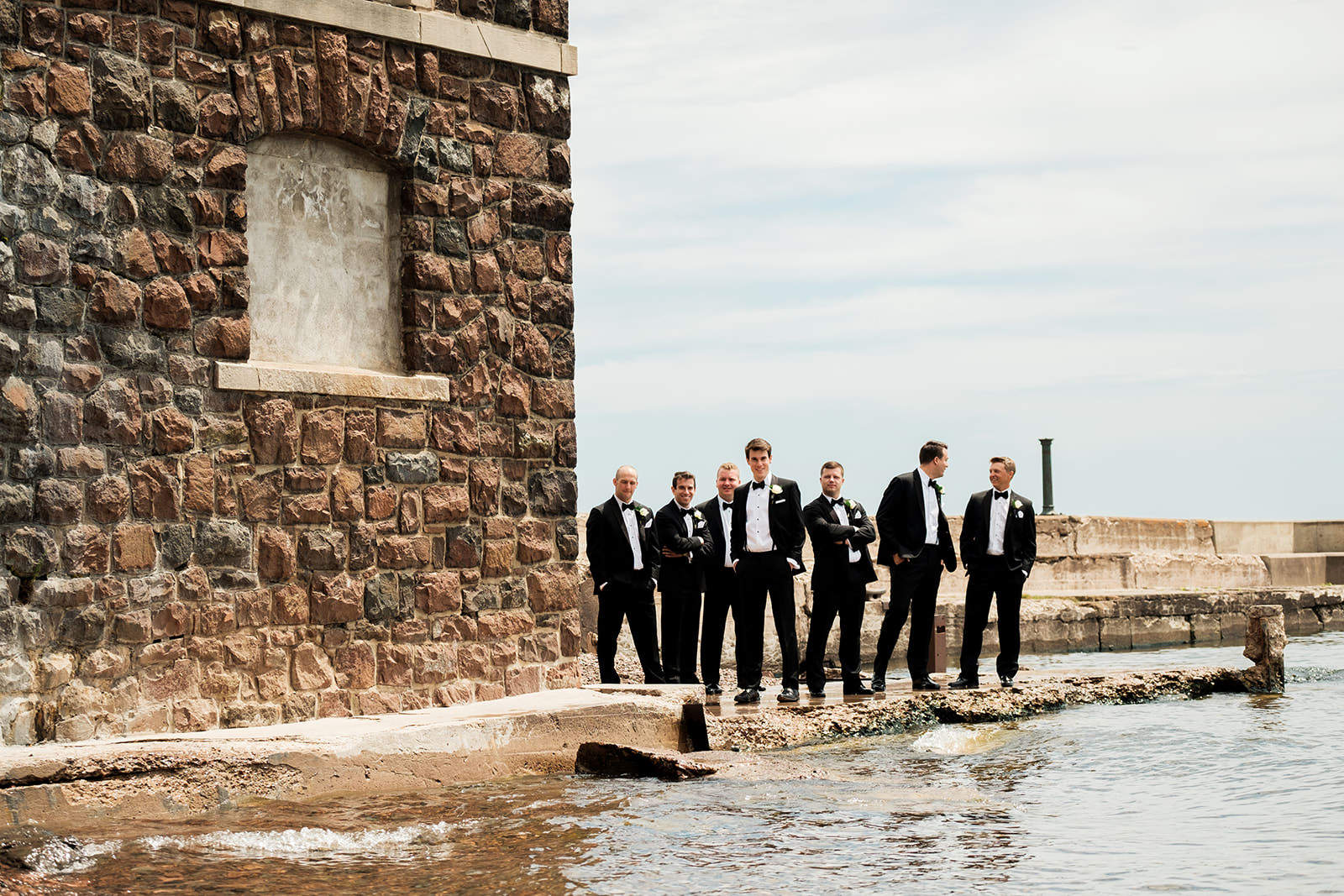 Groomsmen standing on the stone pier at the Duluth harbor — Tim Larsen Photography, Brainerd Lakes MN