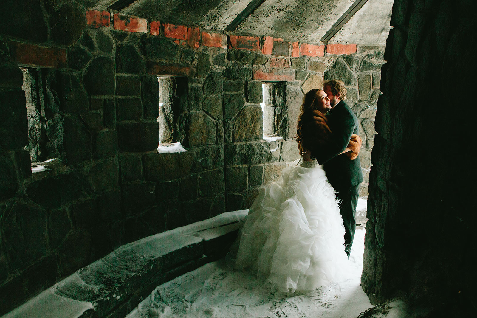 Couple kissing in a stone castle ruin in winter — North Shore — Tim Larsen Photography, Brainerd Lakes MN