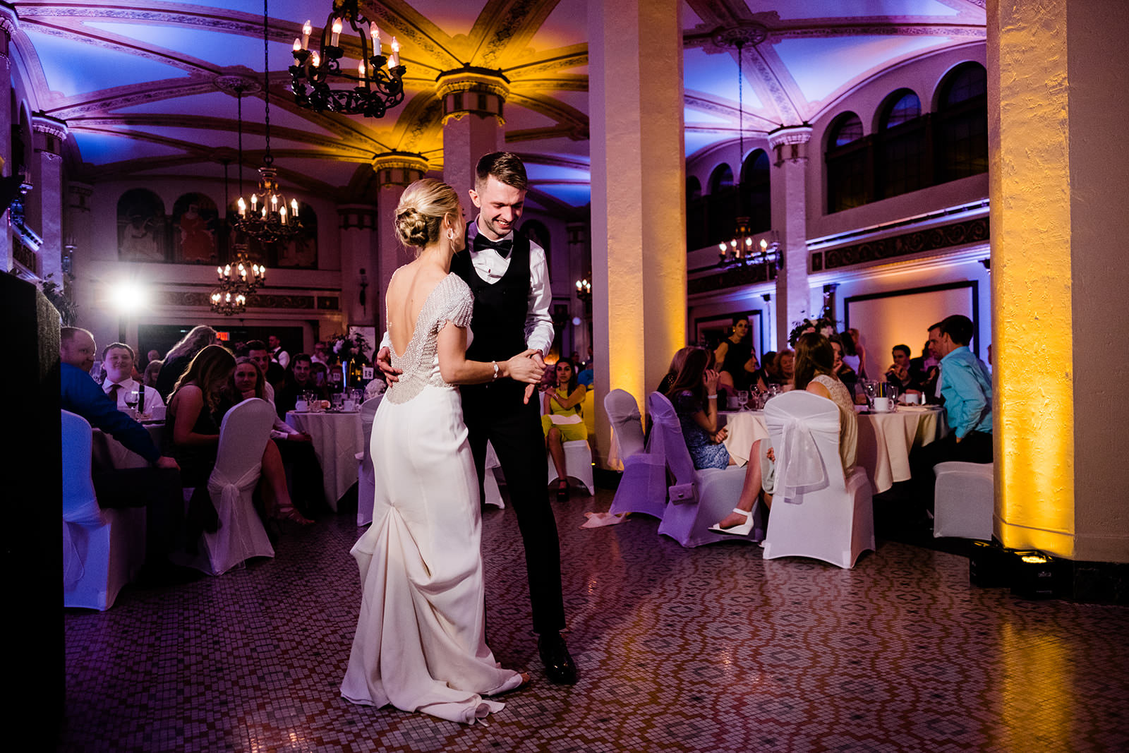 First dance in a historic Duluth ballroom with chandeliers and uplighting — Tim Larsen Photography, Brainerd Lakes MN