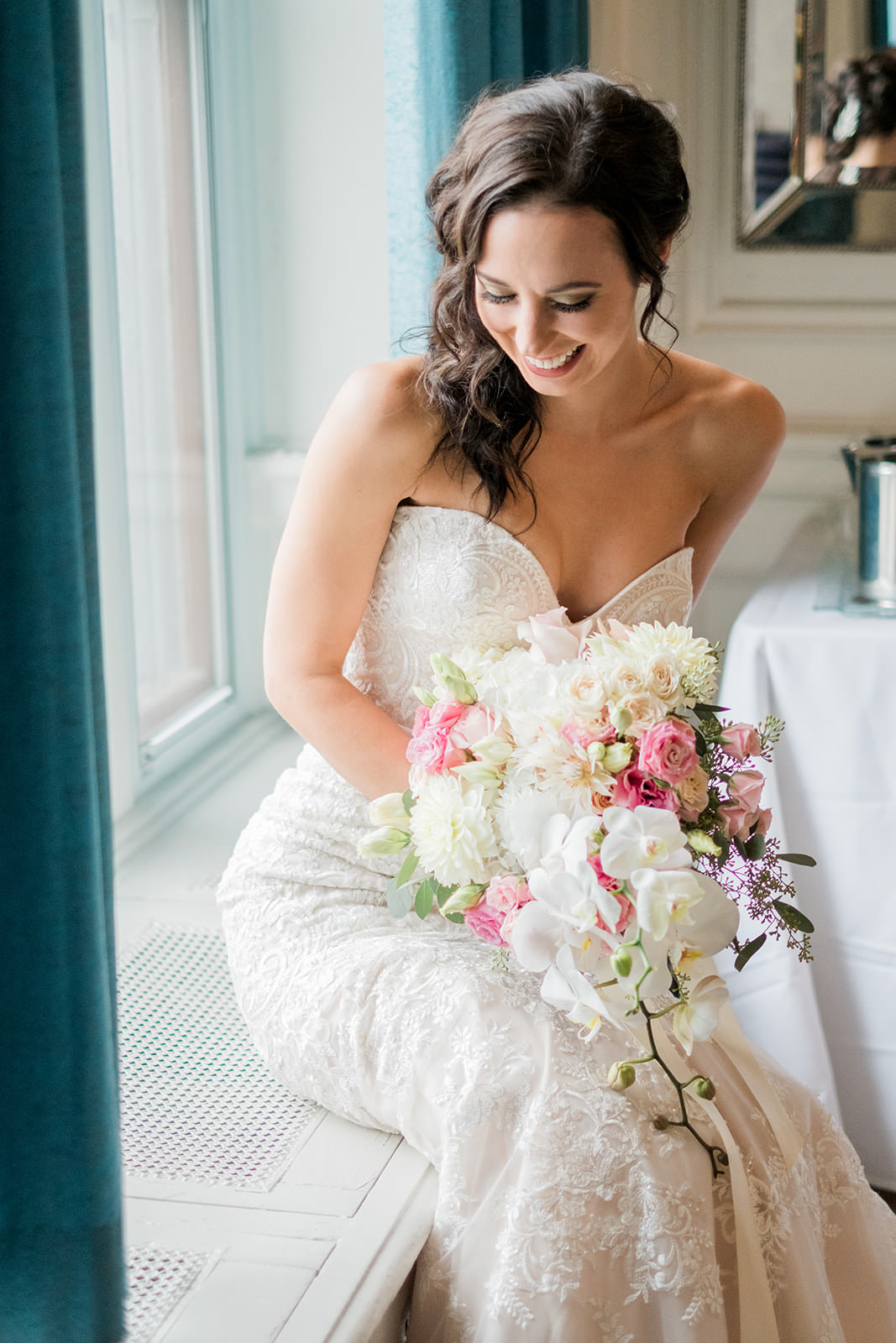 Bride with bouquet of white peonies and orchids — getting ready by the window — Tim Larsen Photography, Brainerd Lakes MN
