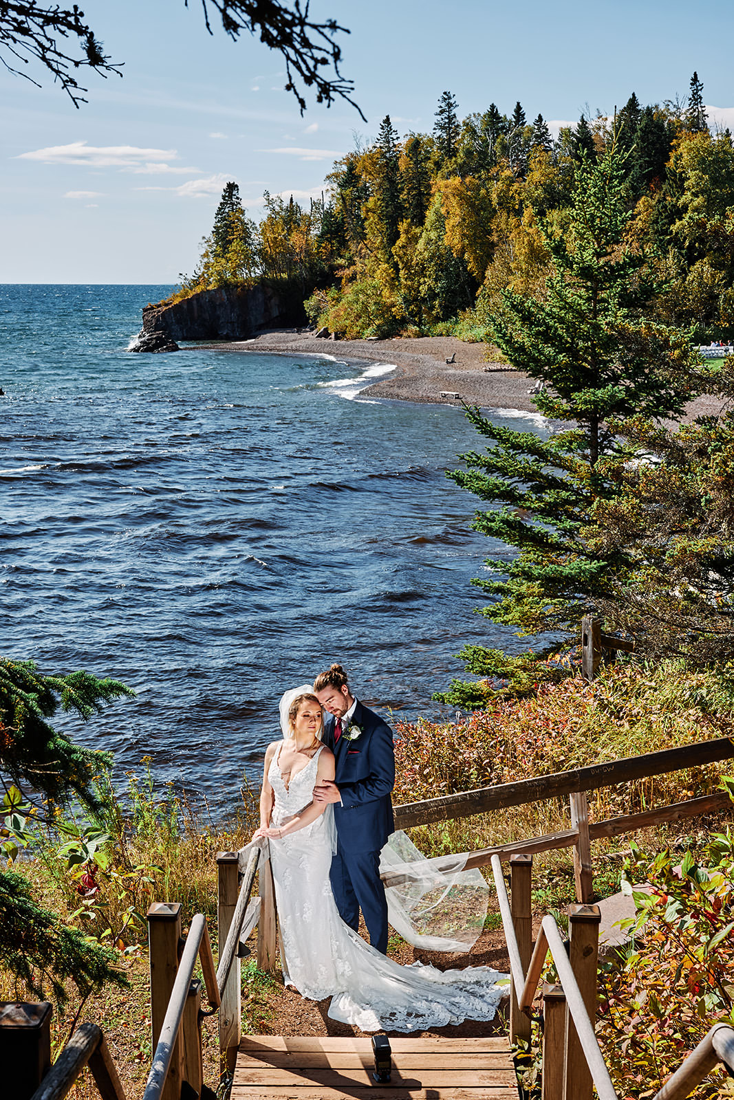 Couple on the wooden staircase overlooking Lake Superior and fall color on the North Shore — Tim Larsen Photography, Brainerd Lakes MN